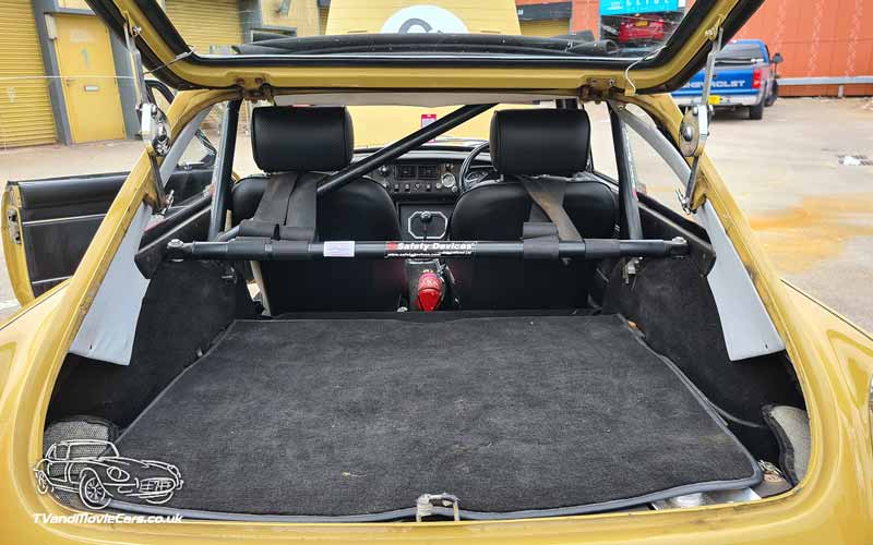 TV Film Movie Action Vehicle Scotland UK Cars MG BGT Coupe (1971) interior boot 800px